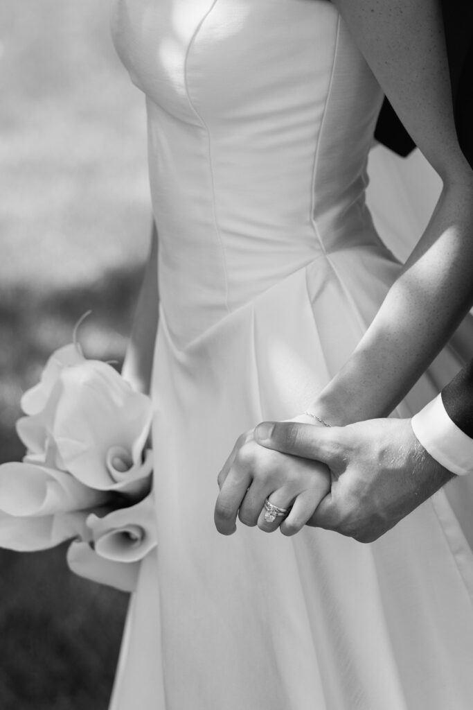 Bride and groom hands | holding hands during bridal portraits | at a venue in Fargo nd